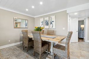 The dining area features a custom-crafted table for six ...