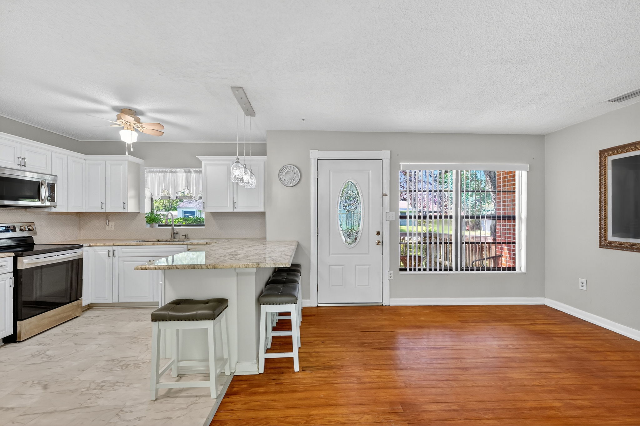 Foyer, Living Room, and Kitchen