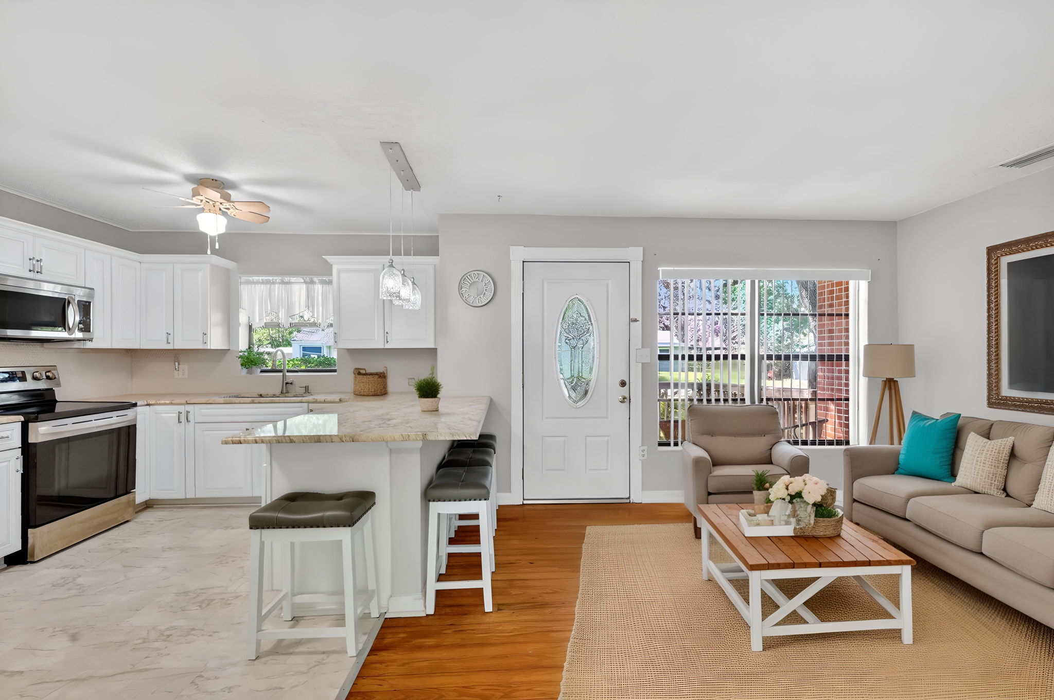 Virtually Staged - Foyer, Living Room, and Kitchen