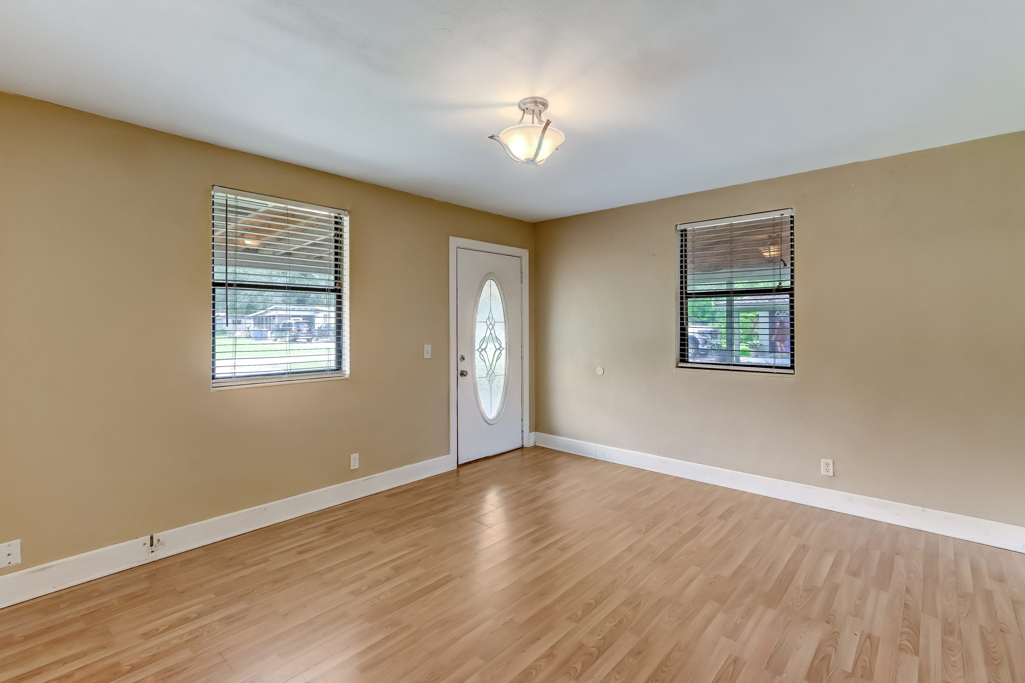 Front enters into family room, wood laminate flooring