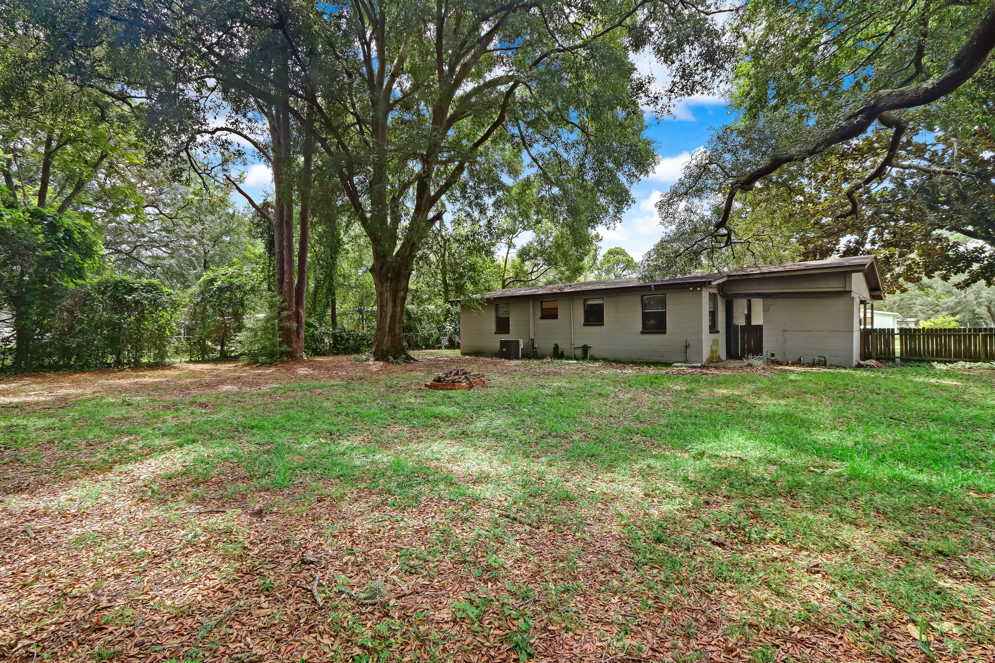 Completely fenced and graced with beautiful Oaks.