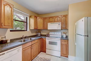 Kitchen faces picturesque, private backyard