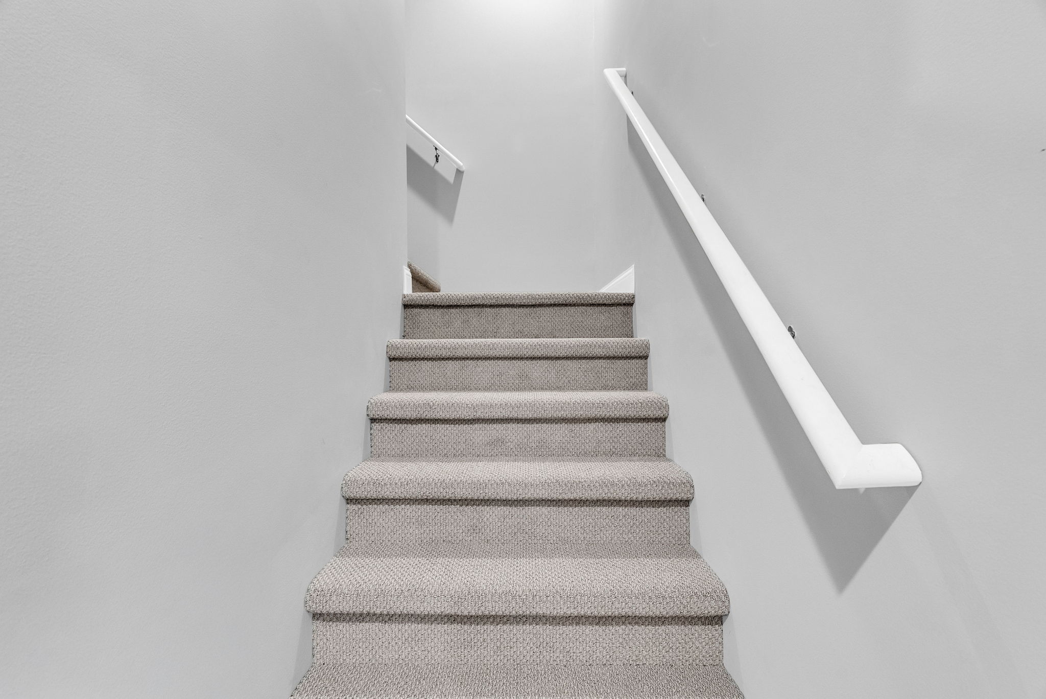 stair case leading to unfinished 700 sq st room