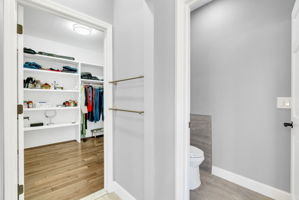 Large walk -in-closet with shelving