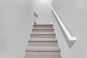 stair case leading to unfinished 700 sq st room
