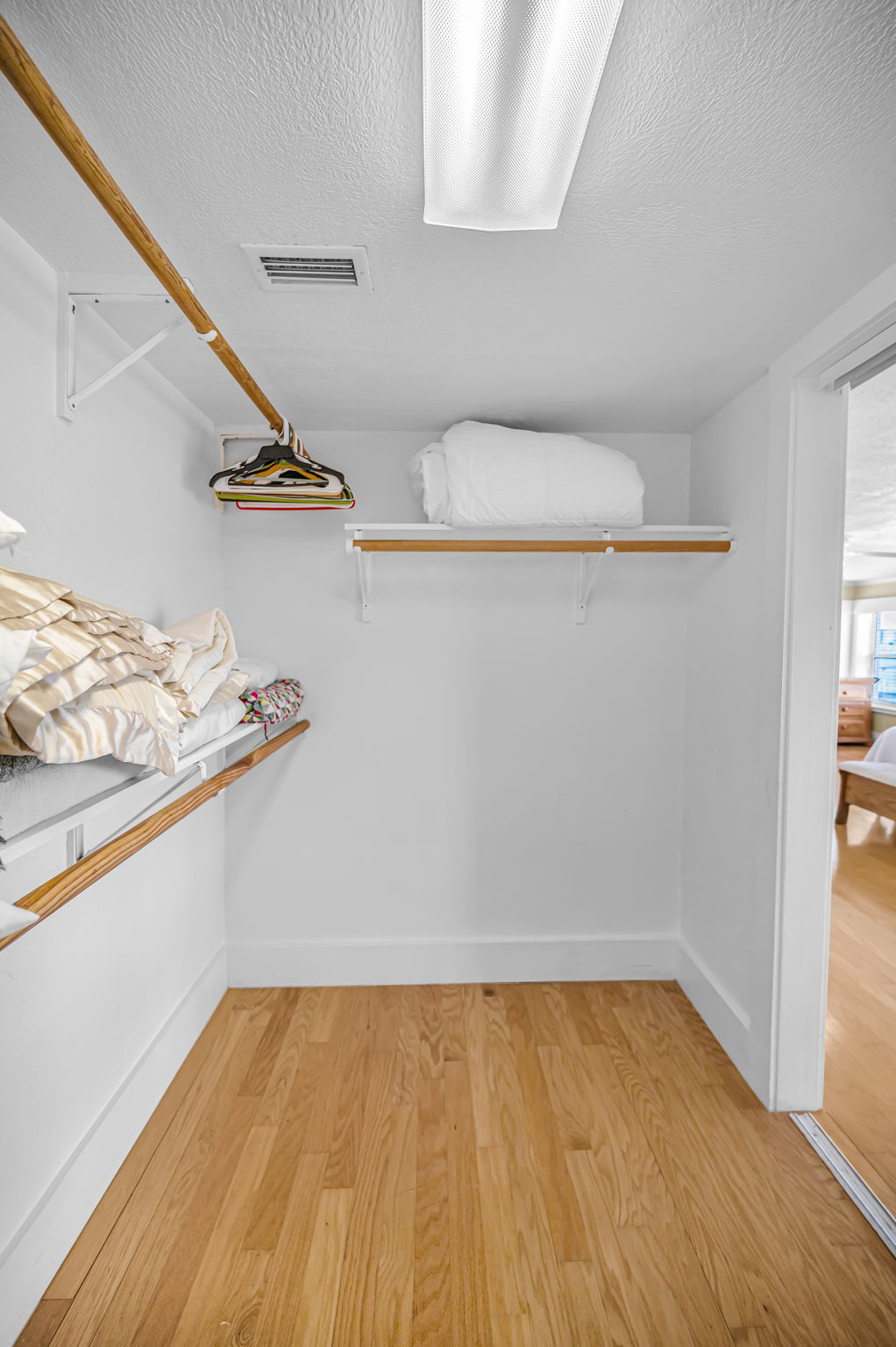 Upper Level Primary Bedroom Walk-in Closet1b