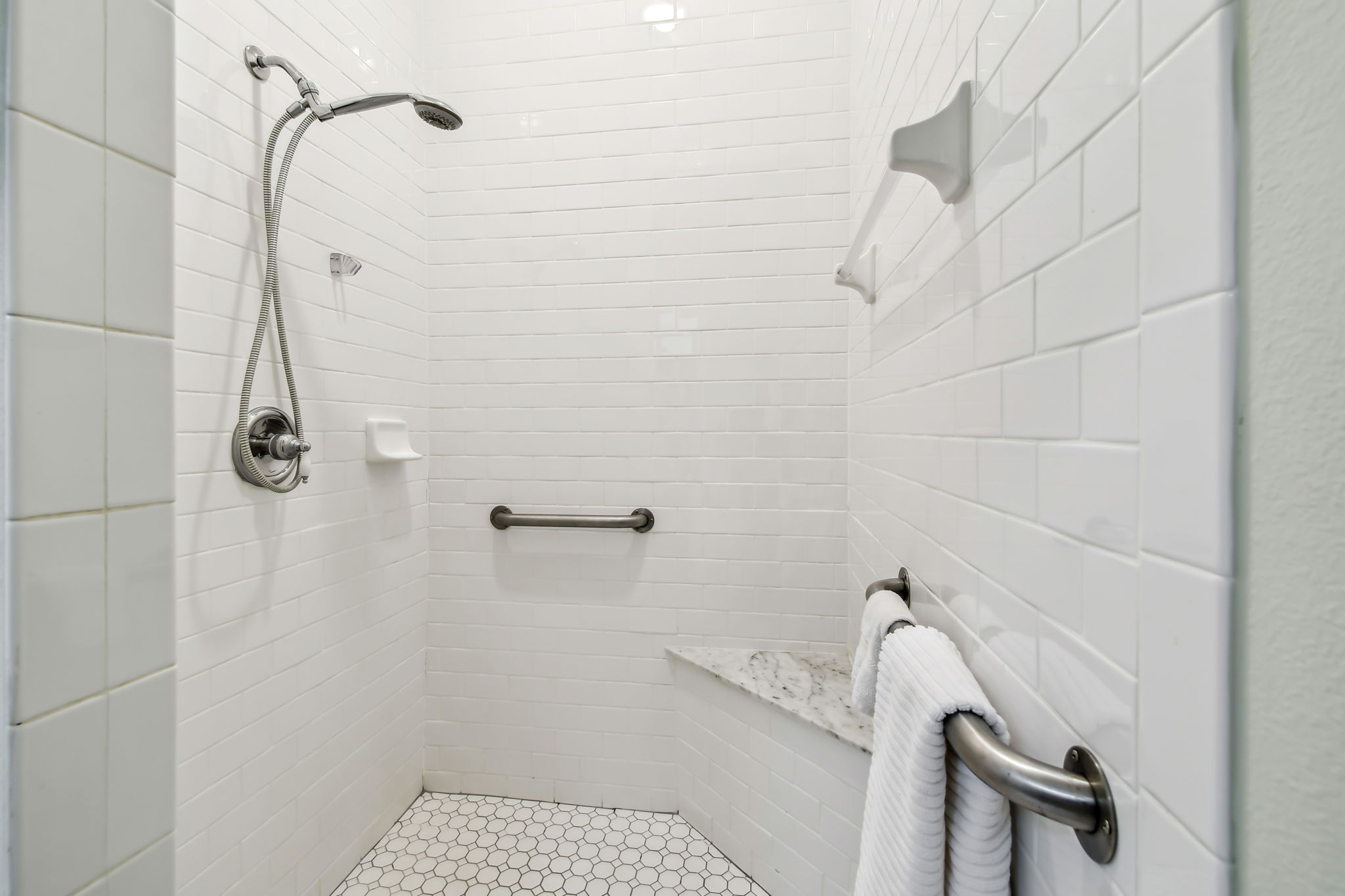 Owners Bathroom has Roll In Accessible Shower