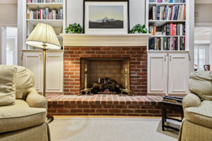 Natural gas brick fireplace warms the space quickly