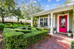 Brick paved walks lead to the covered front porch