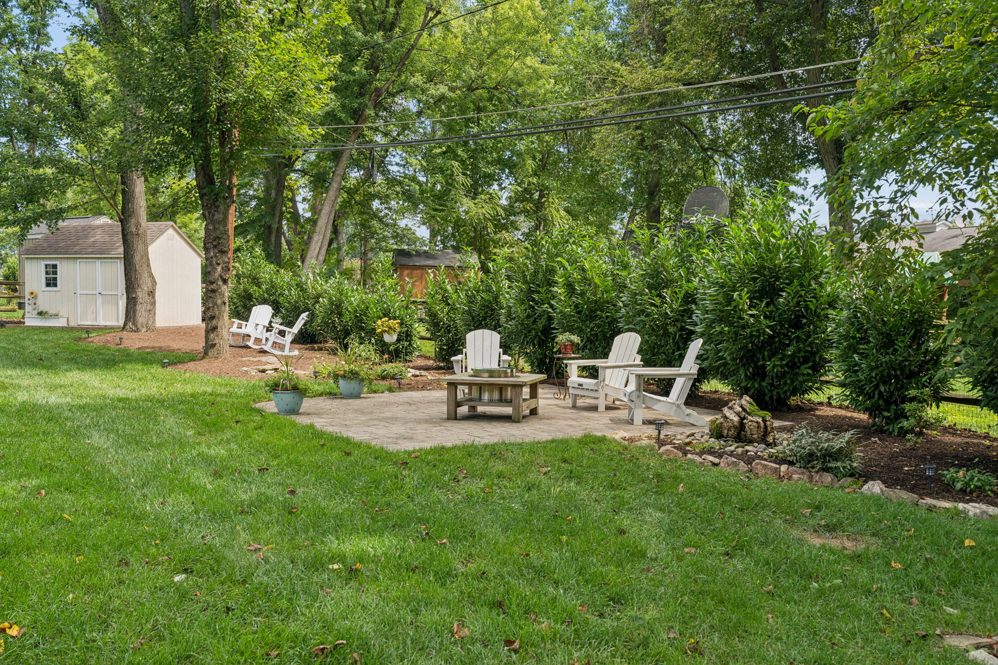 Water feature is to the right of patio