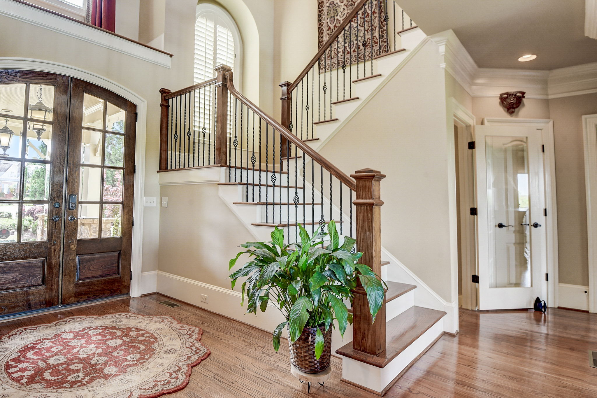 Gorgeous Double Doors and Wrought Iron Spindle Staircase