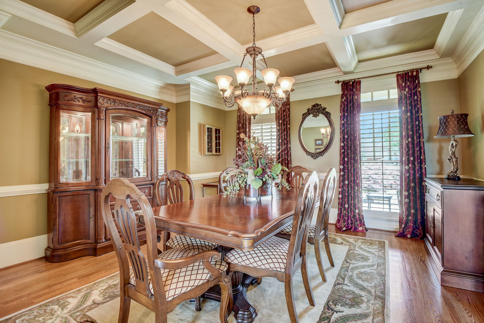 Dining Room With Coffered Ceiling! Plantation Shutters on Front of Home!