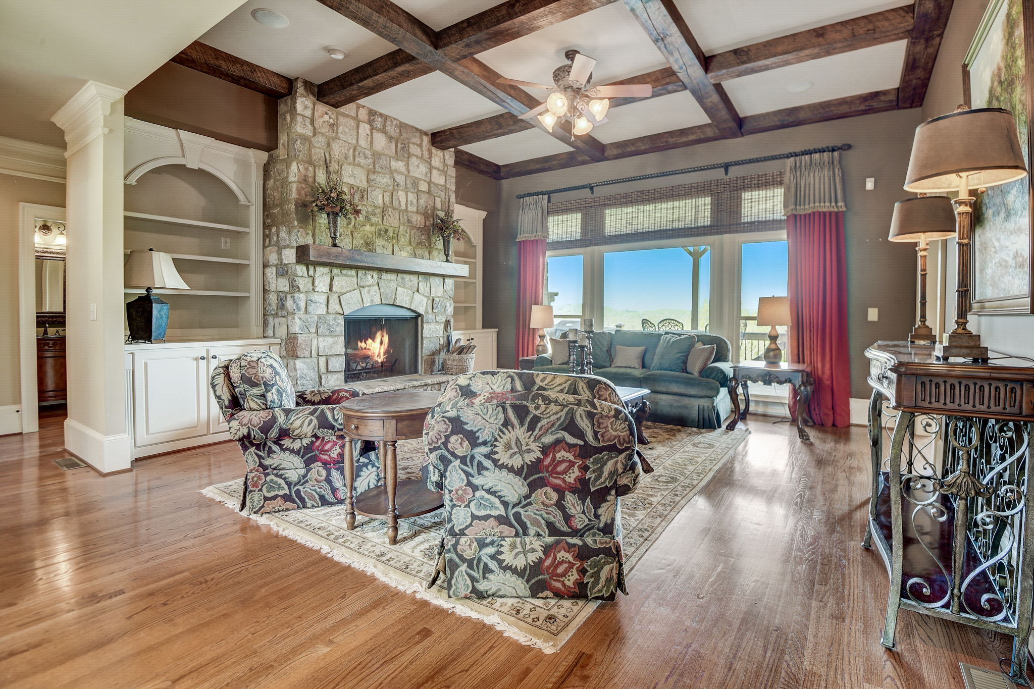 Spacious Living Room with Coffered Ceiling Made with REAL Cedar Beams, Stately Fireplace and Built-in's!