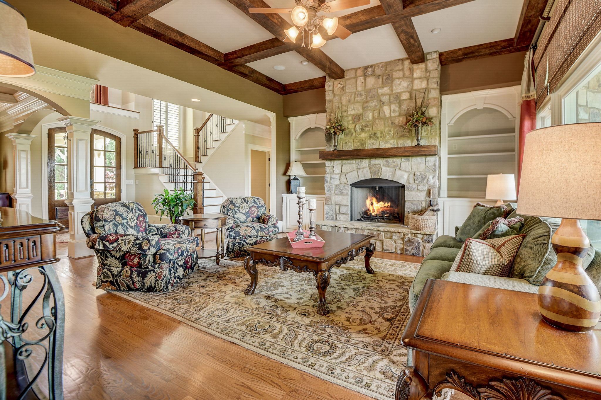 Spacious Living Room with Coffered Ceiling Made with REAL Cedar Beams, Stately Fireplace and Built-in's!