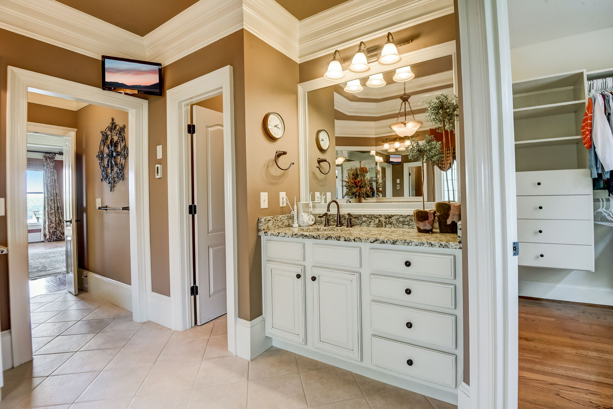 Primary Bathroom with Separate Tiled Shower and Tub, and Double Vanities with Granite Countertops