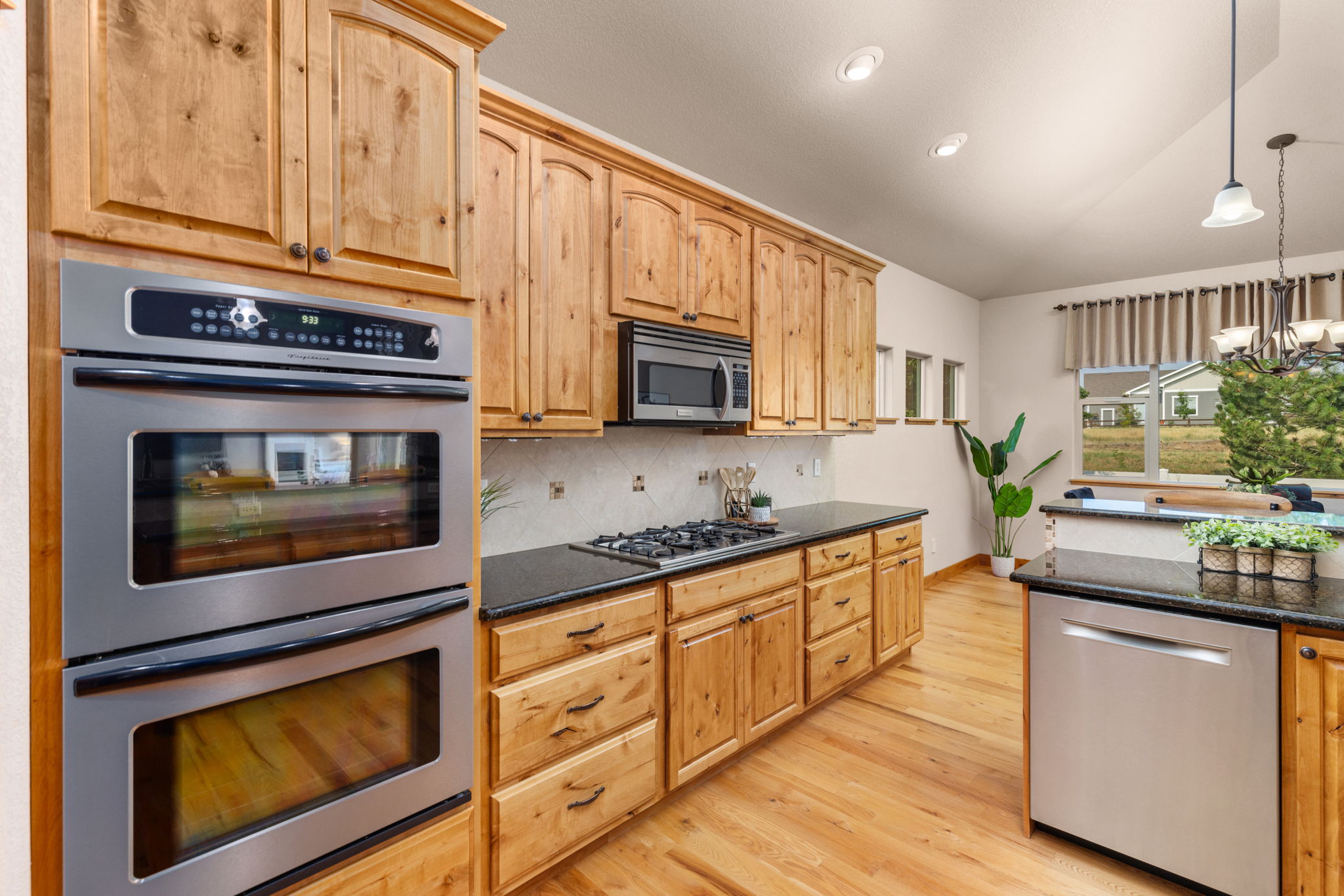 Gorgeous Knotty Alder Cabinets, Double Oven, and All St Stl Appliances