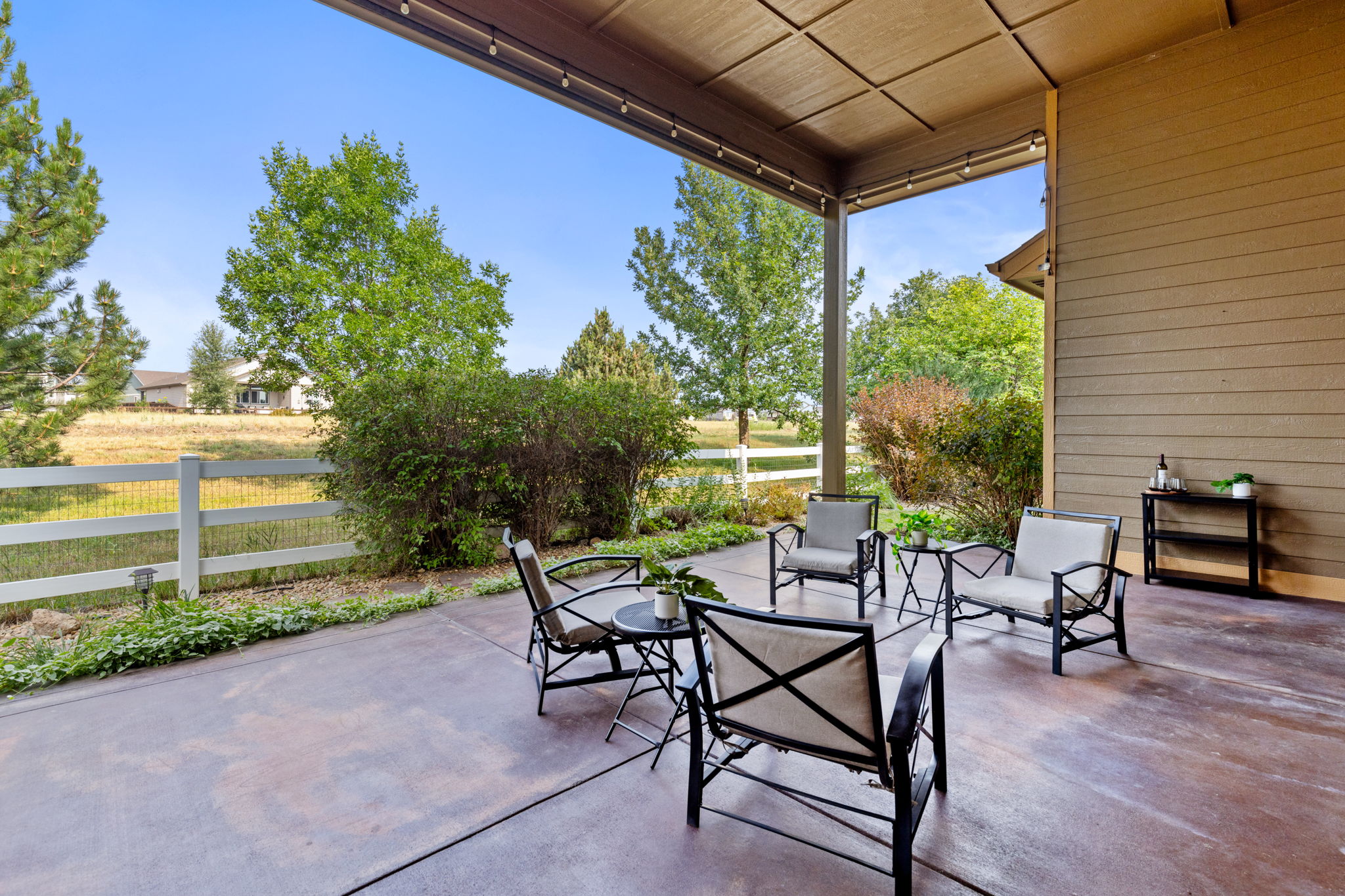 Relax Outside on the Covered Patio with Remote Controlled Retractable Sunshade