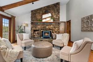 Fieldstone fireplace, soapstone woodstove, Simulated fire
