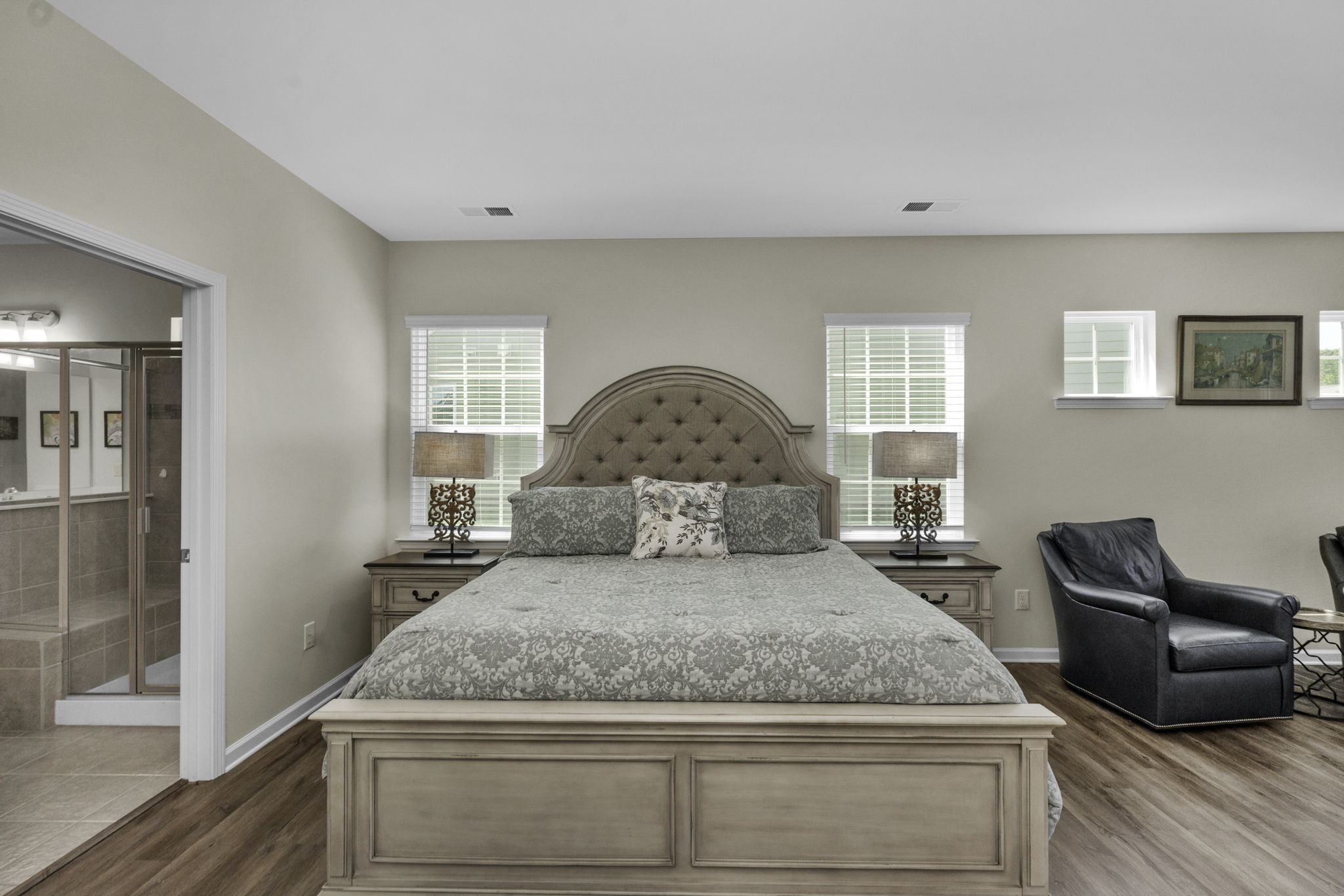 Primary bedroom with sitting area and primary bathroom.