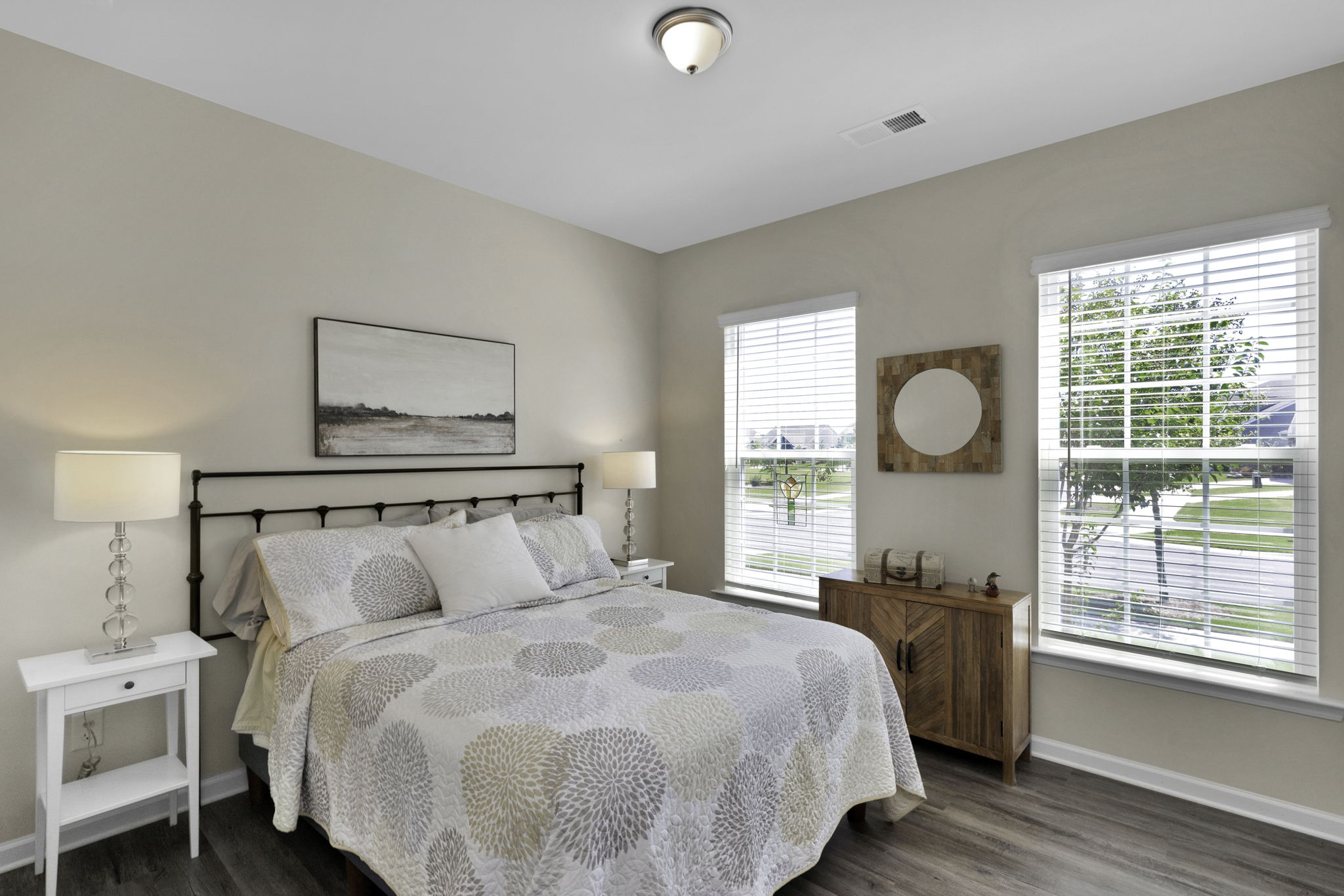 The 'Split Bedroom Plan' has the guest bedrooms up front and allows for privacy for your guests with 2 bedrooms and a full bath. Guest Bedroom #1 pictured.