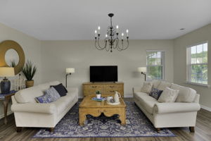 Spacious Great Room open to kitchen, breakfast area and back patio and yard.