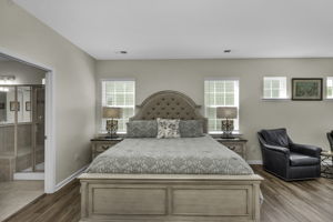 Primary bedroom with sitting area and primary bathroom.