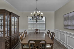 Dining Room with Antique Chandelier and Elegant Moldings