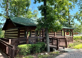 Log Cabins: #1 Arts and Crafts, #2 Multi-purpose Cabin, #3 Post Office, #4 Reading, #5 Business, #6 Sewing, #7 Fitness, #8 Cards, #9 Celebration Cabin, #10 Billiards