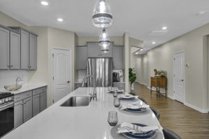 Oversized quartz island allows ample seating.