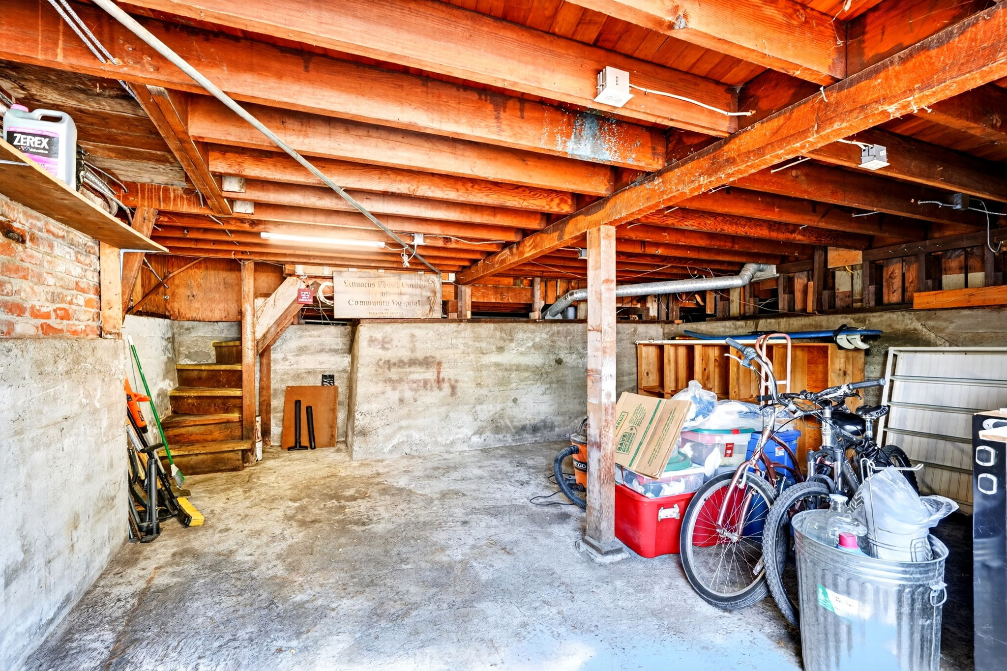 It's hard to see in this photo but this is the 2 car garage under the main level.  Interior access to the main home is up the stairs to the left.