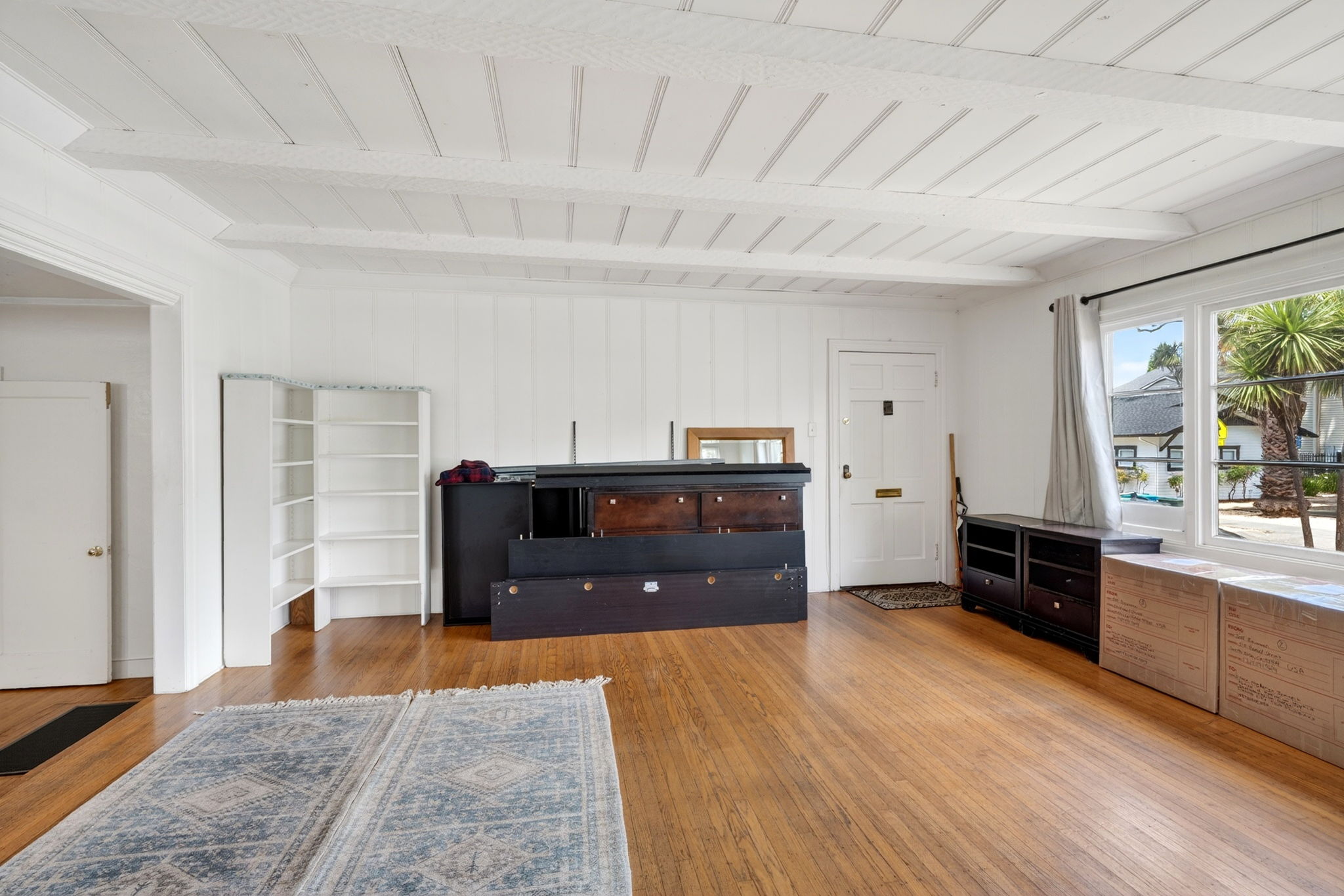 The living room.  The main entrance is through the door on the right.