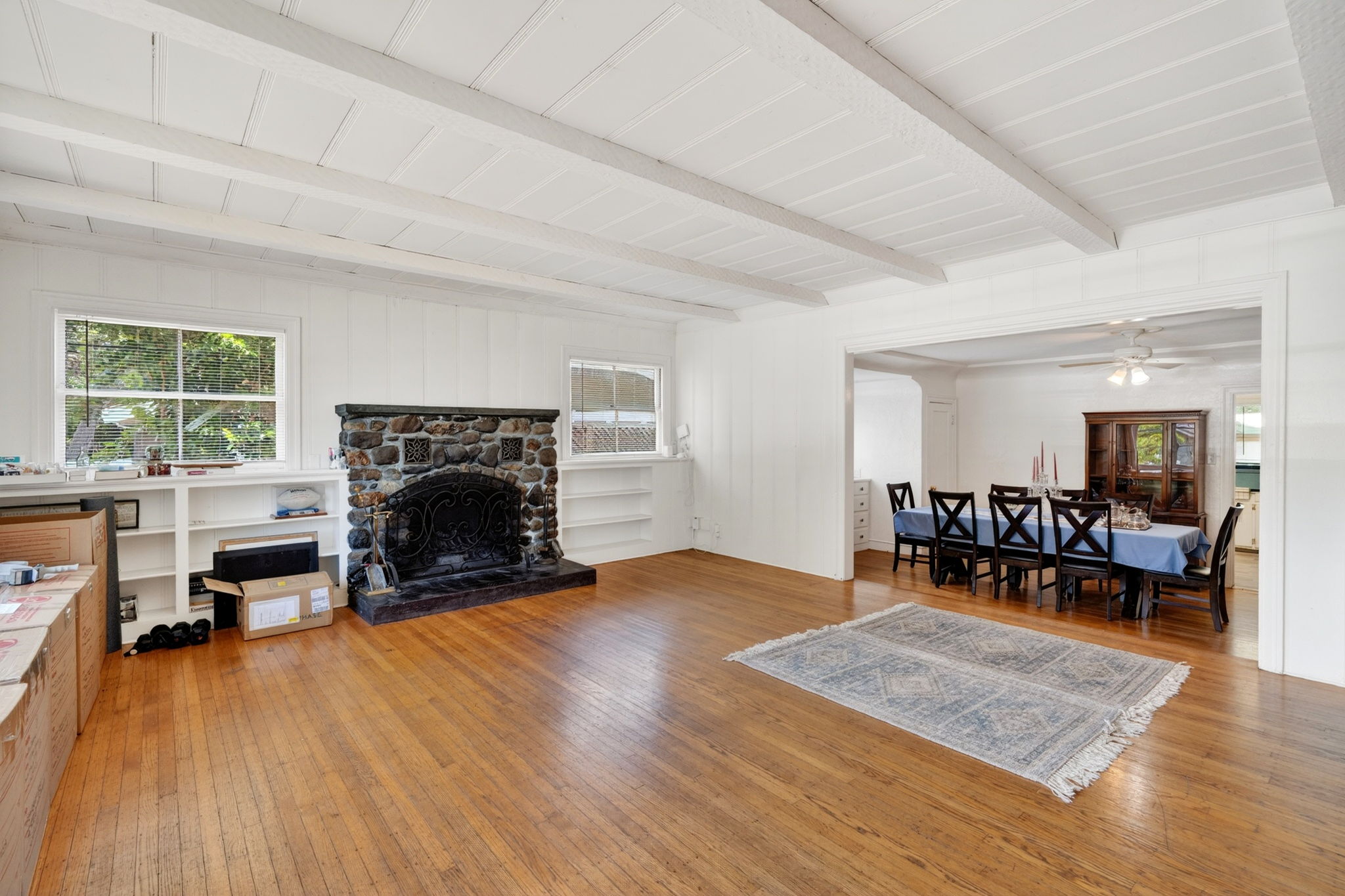 The living room looking in from the front door.  Look at that beautiful fireplace and mantel.
