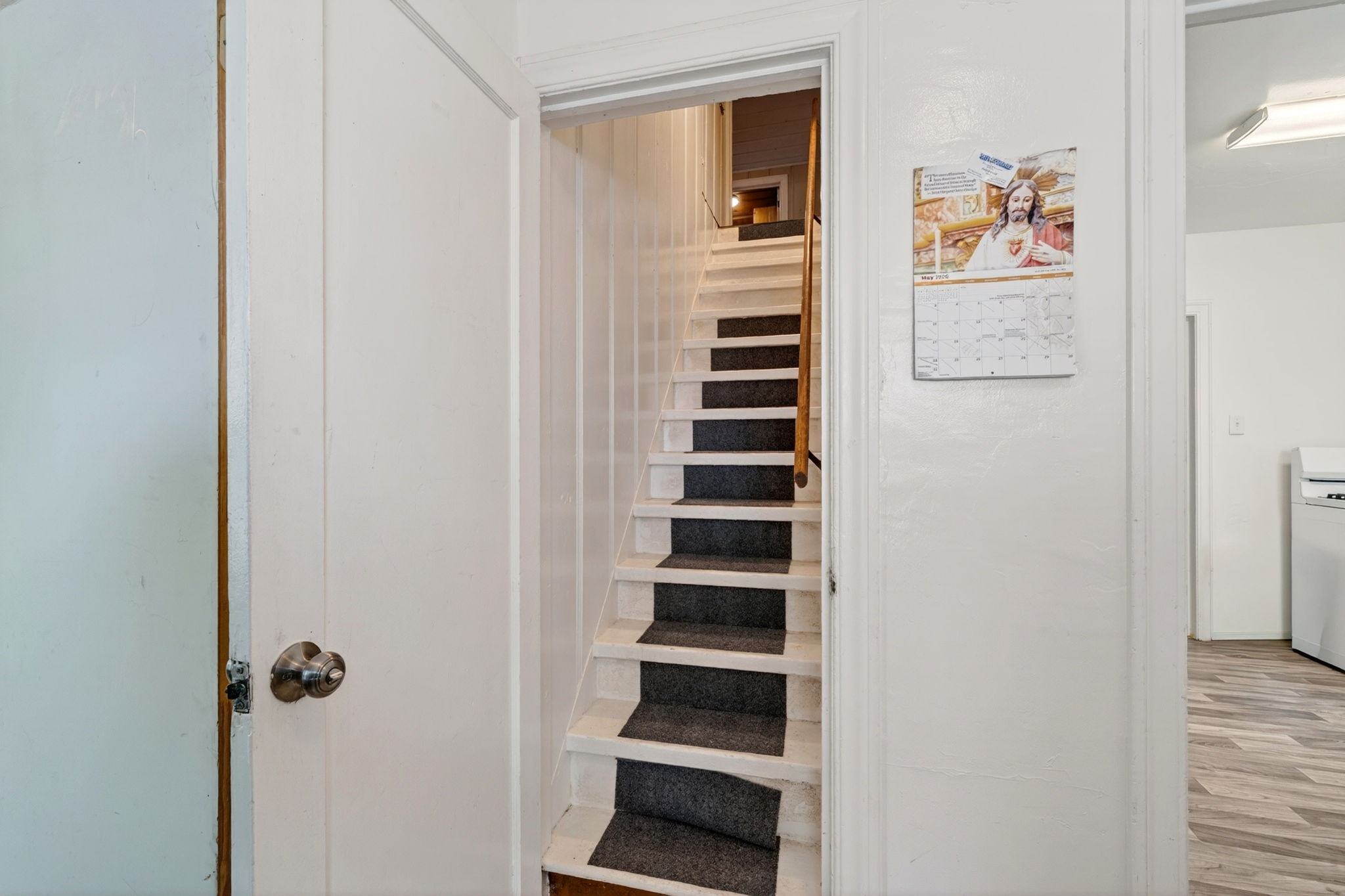 The stairs to the upstairs primary suite.  Don't miss the large hidden hideaway!
