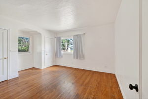 Downstairs bedroom #1.  2 closets and wood floors.