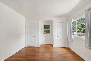 Downstairs bedroom #1.  2 closets and wood floors.