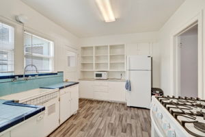 The kitchen.  The dining room is to the right.  The laundry area, canning room and upstairs primary suite is to the left.