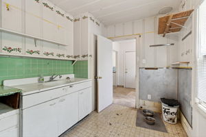 The canning room with what looks like an area for a stove to the right.