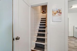 The stairs to the upstairs primary suite.  Don't miss the large hidden hideaway!