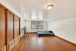 The primary bedroom with built in closets and drawers.  The sitting room is behind this view.