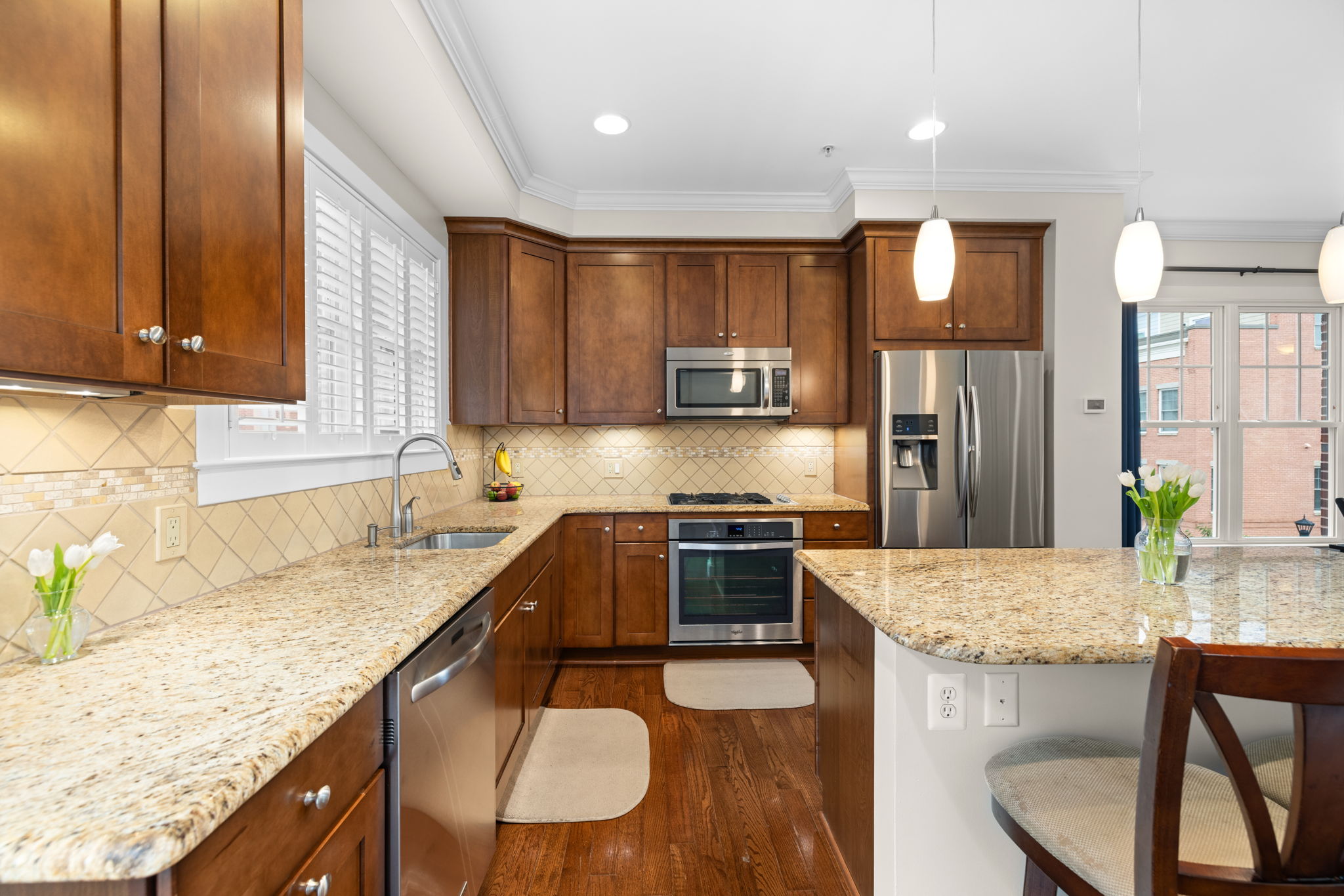 Kitchen with granite counters, recessed and under cabinet lighting