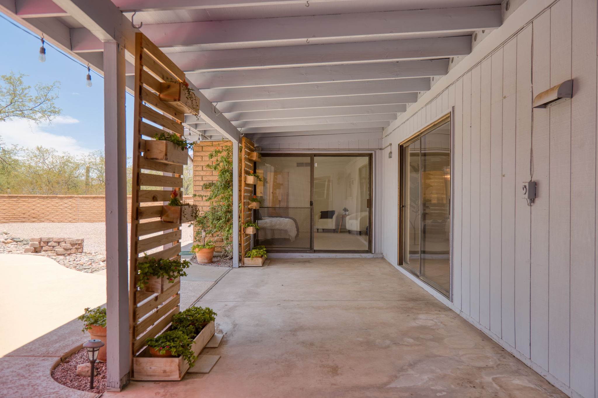 Covered Porch/slider to one of the primary bedrooms