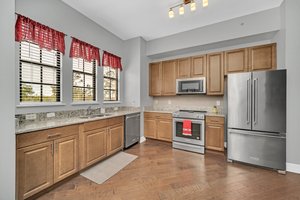 Designer Upgraded Kitchen with Wood Cabinets and Granite Counters