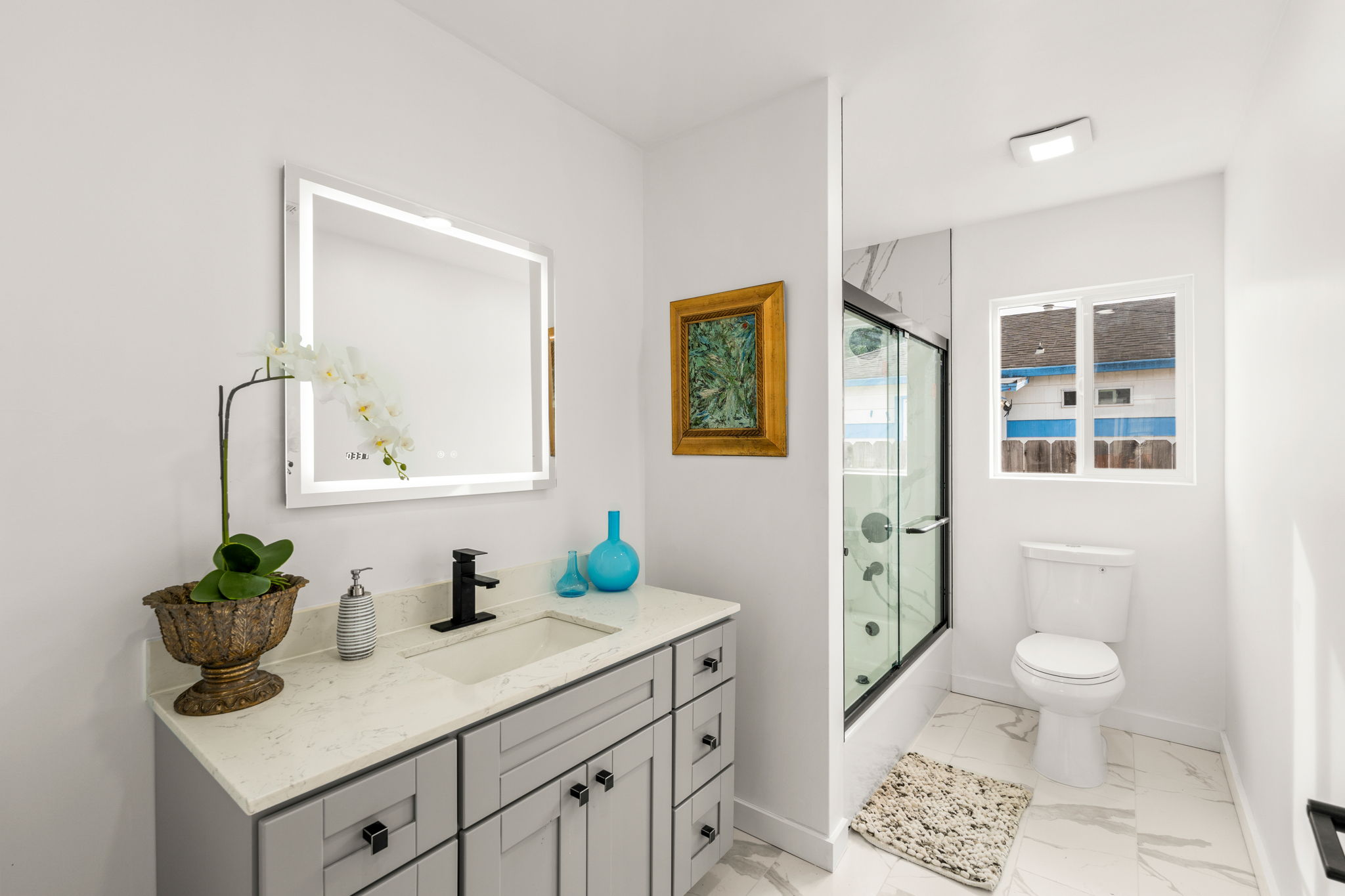 Bathroom features new Vanity with Lighted Mirror