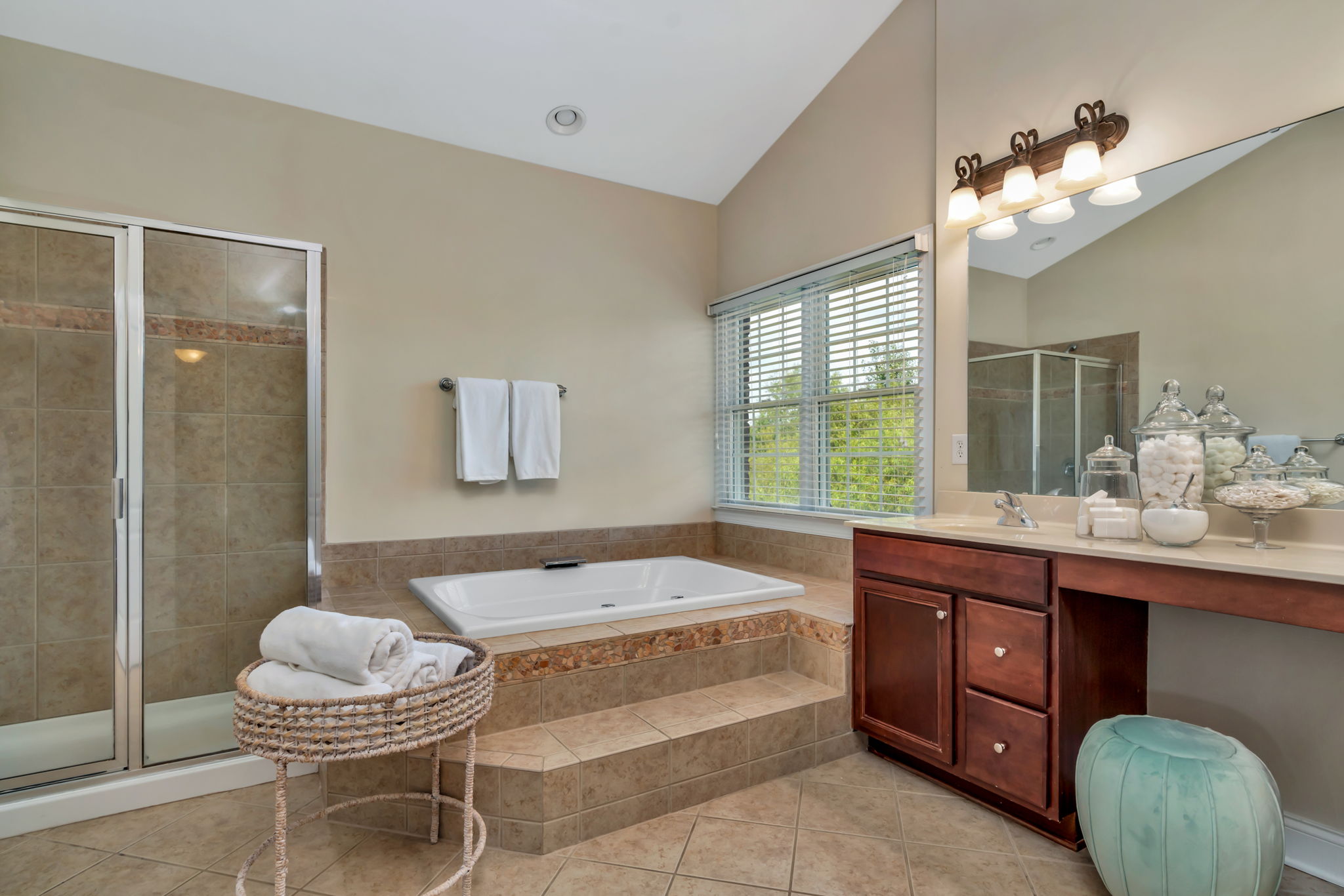 Spacious master bath with jacuzzi bath, separate shower, double vanities, linen closet and separate wc.