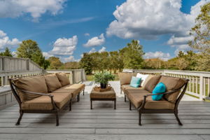 Expansive deck has built-in seating and storage. Great size and set up for entertaining.