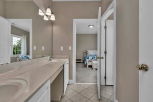 Spacious Jack and Jill bathroom with double vanities, shower, and tub.