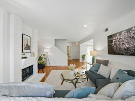 Living Room w/Fireplace and Patio Access