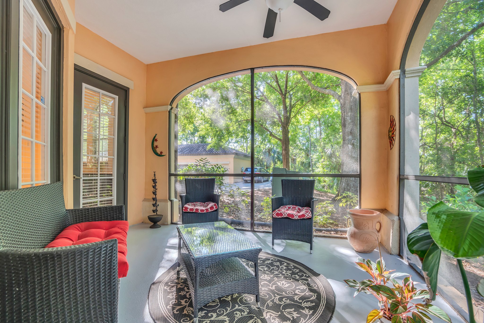 Private patio with great views of trees, tennis courts, and canal