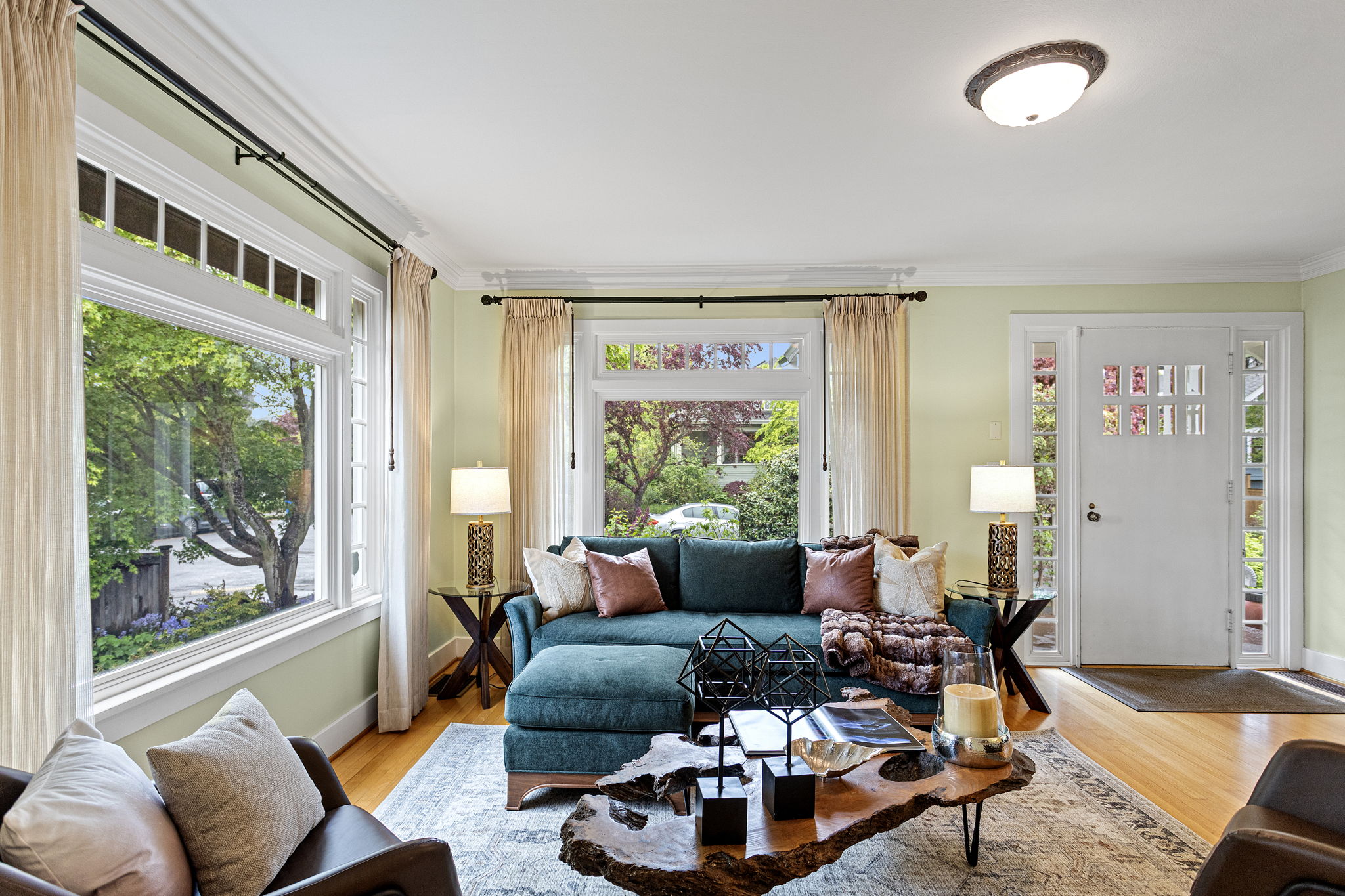 The view opens into the formal dining room, highlighting the uncompromised molding and the transition to the private quarters.