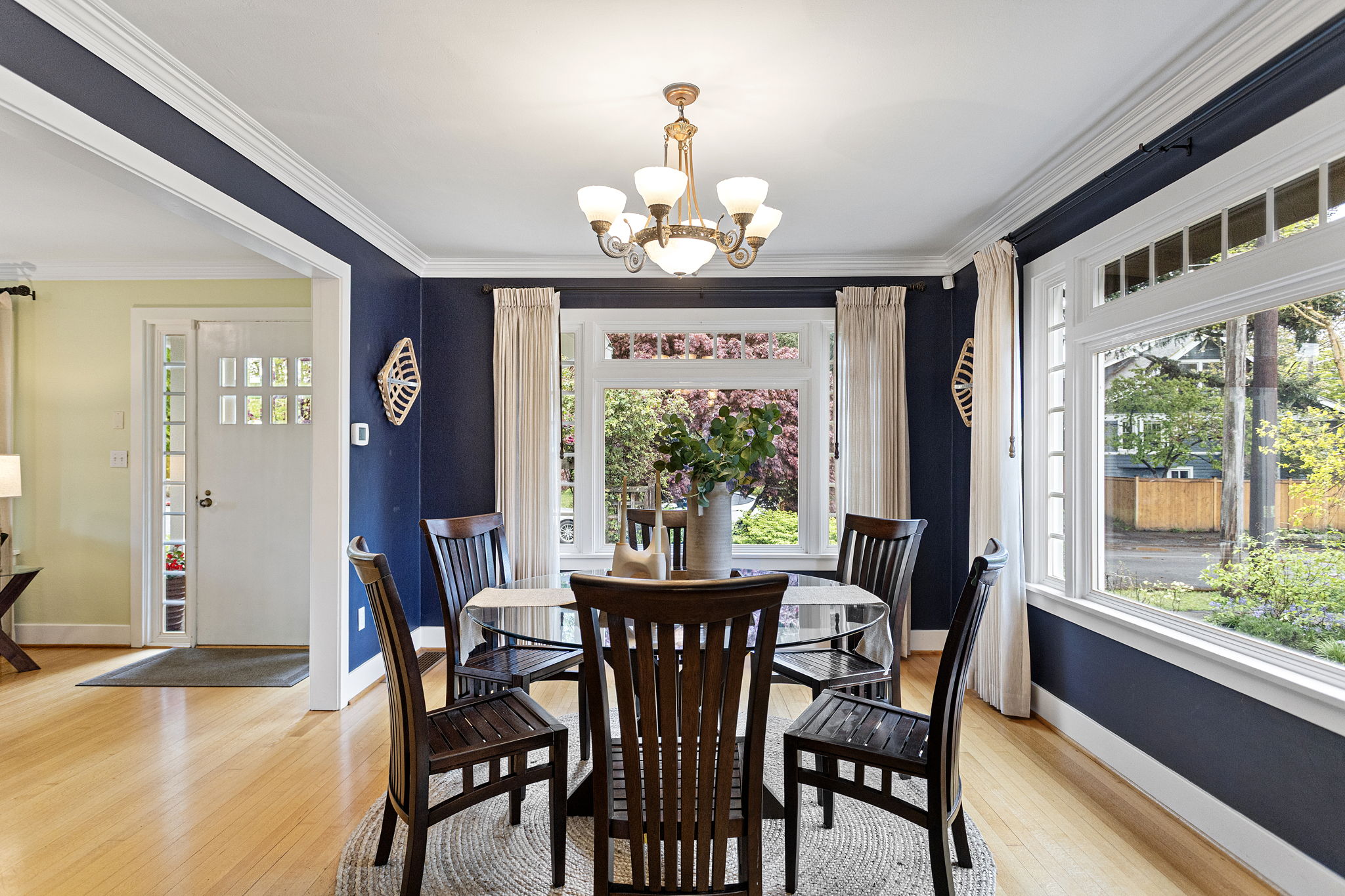 The dining room sits between the kitchen and the living room. (That's not an accident — that's the plan.)
